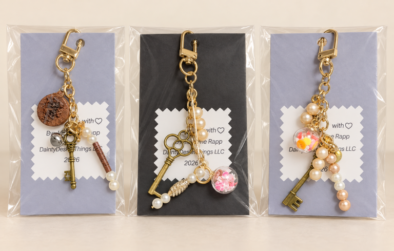 Handmade purse charms with keys, pearls, beads, and globes.